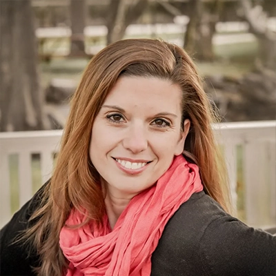 Lizzie Ambrose smiling outside.